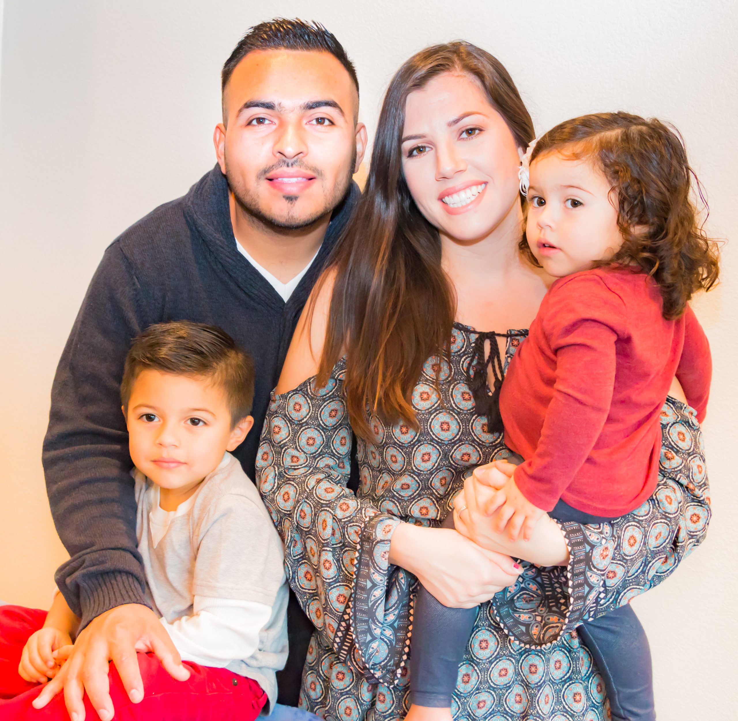 Portrait of Happy Hispanic Family Hanes Alia