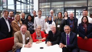 A photograph of a group of people at the Work that Works for Everyone Cardiff Business School event.