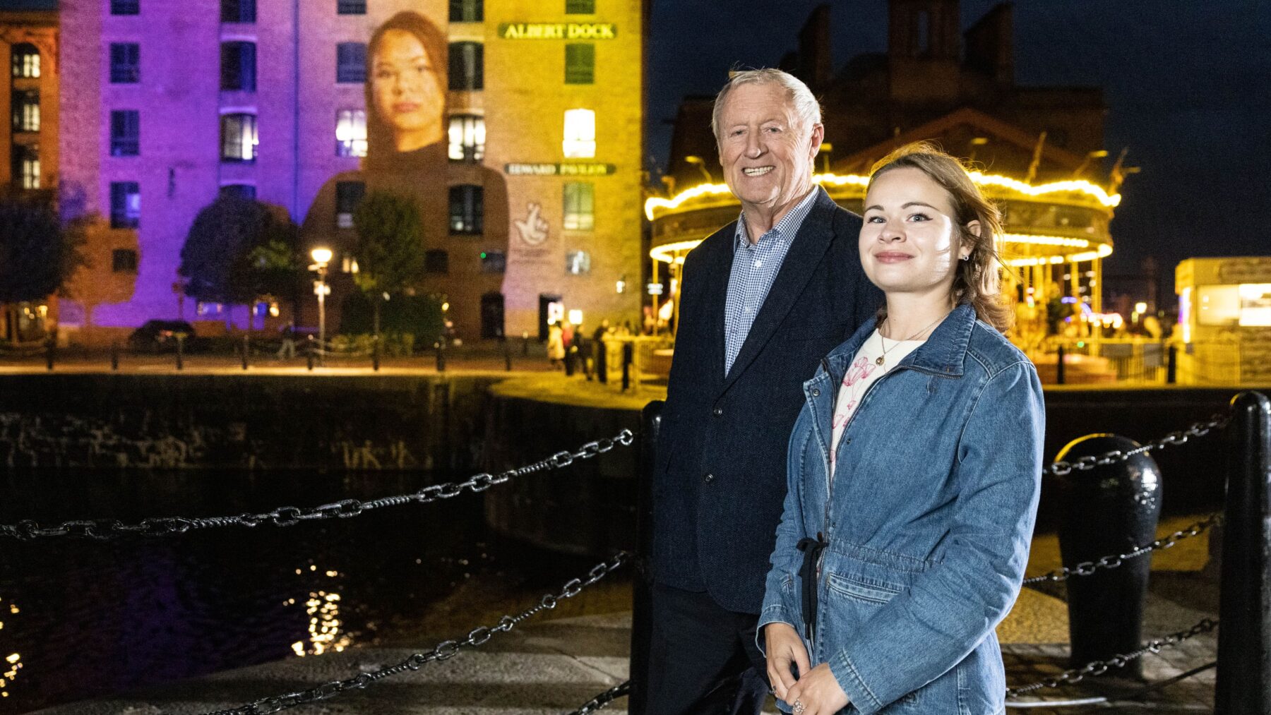 Chris Tarrant and Vladyslava Zhmuro A photograph of Chris Tarrant and Vladyslava Zhmuro at a portrait unveiling at Liverpool's Royal Albert Dock.