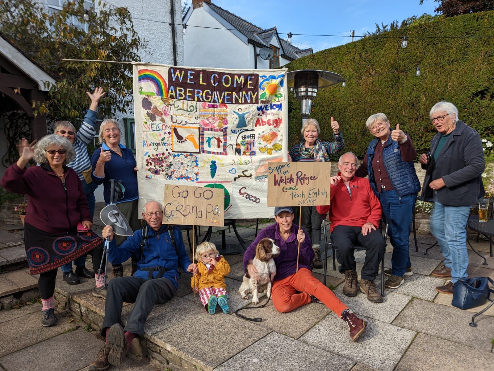 Harry Iles Fundraiser group image A photograph of Harry Iles and supporter s after he completed the Three Peaks challenge to raise funds for asylum seekers.