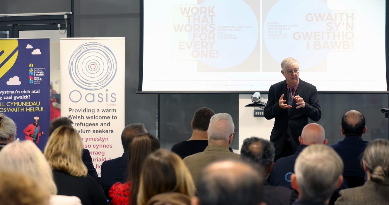 A photograph of First Minister of Wales Mark Drakeford at an event promoting employment for refugees.
