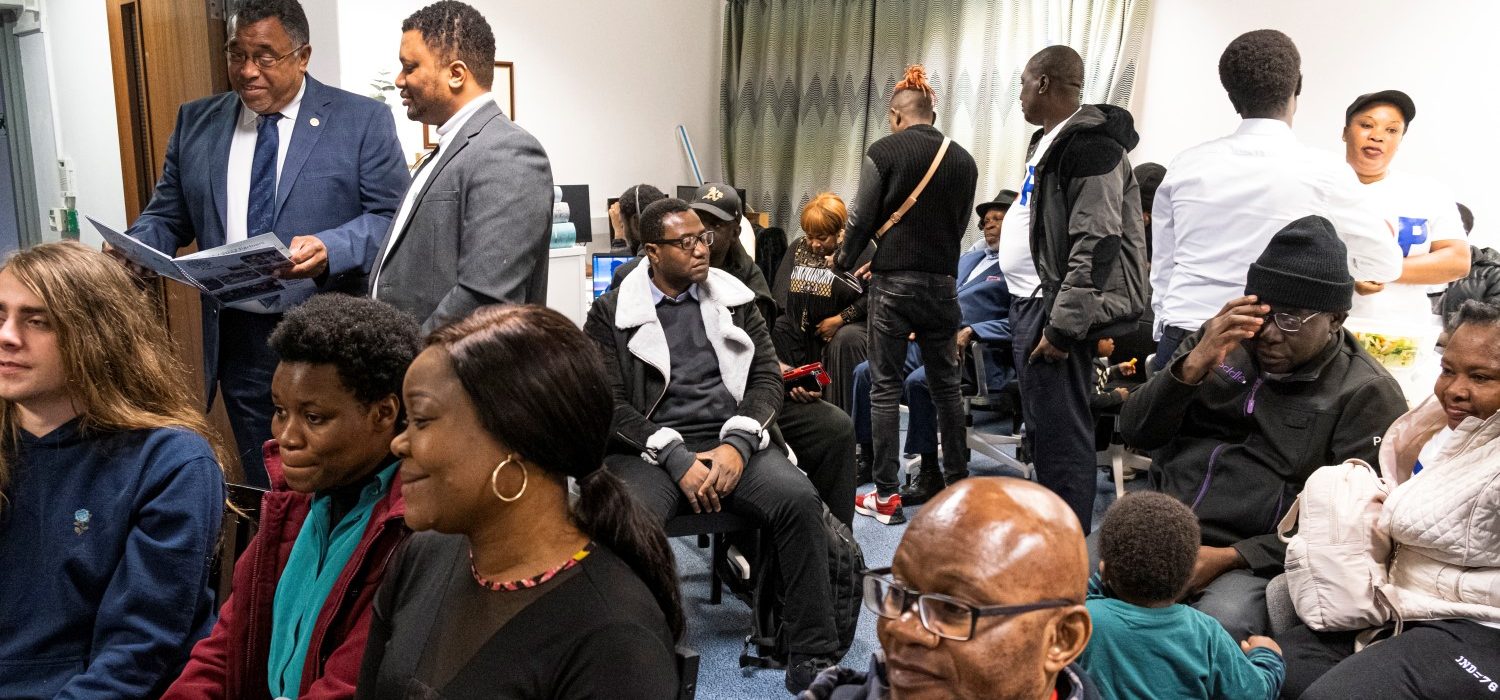 A photograph of people attending a World Mental Health and Black History Month event.