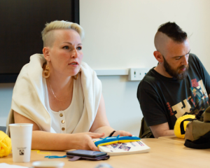 Woman participating in a workshop to understand Ukrainian refugee experiences.