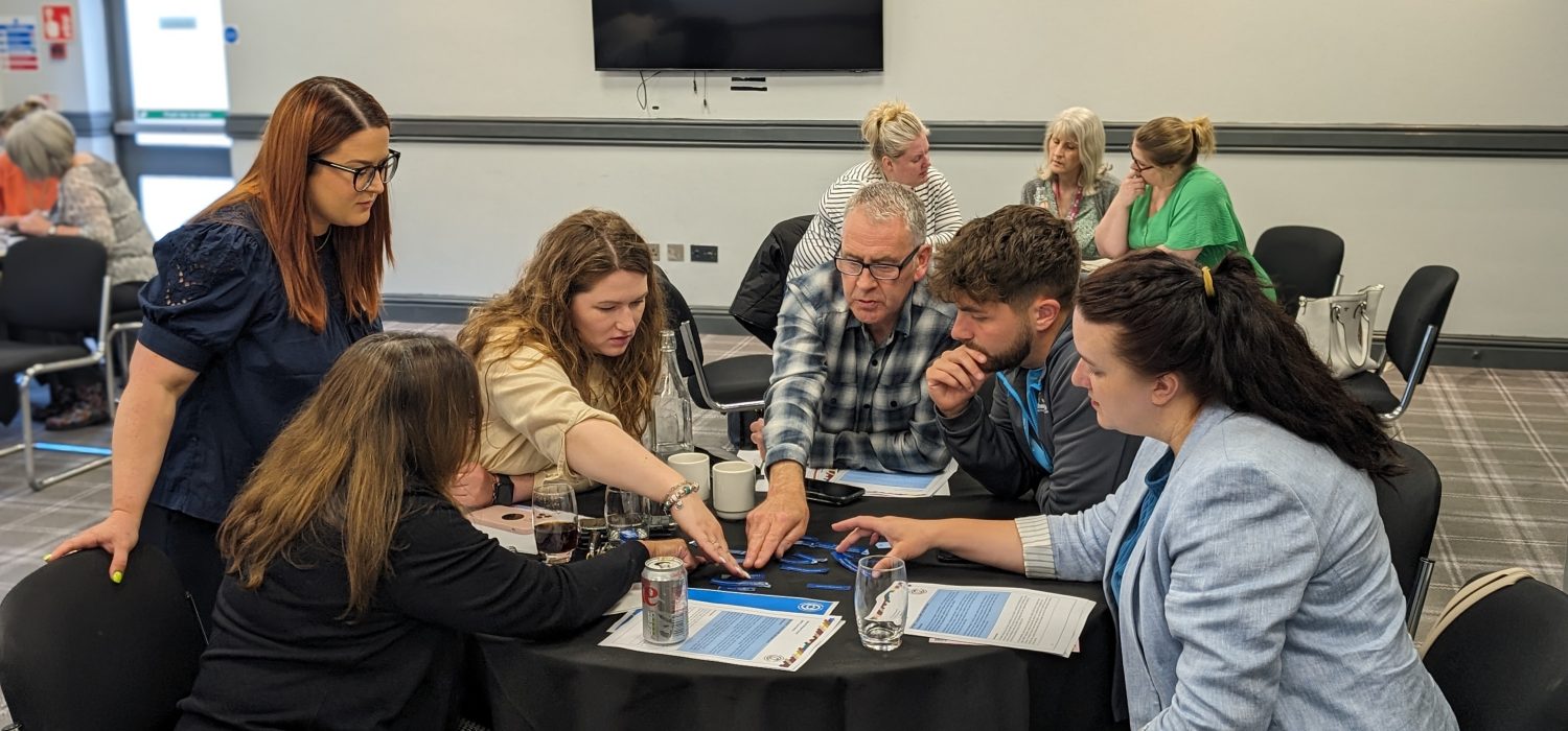 People learning around a table