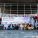 Group of people sat outside the Senedd.