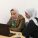 Two women working together at a laptop.