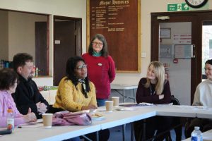 Participants listening to each other at a migration heritage workshop.