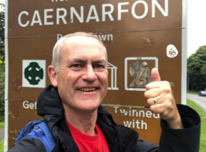 Man fundraising for the Welsh Refugee Council on a sponsored walk.