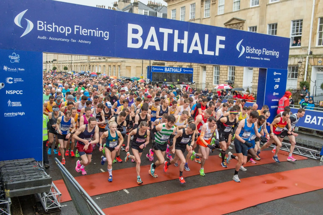 Runners at Bath Half Marathon starting line.