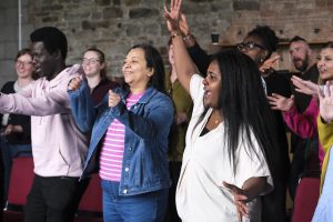 Welsh Refugee Council staff moving together.