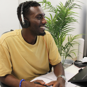 Welsh Refugee Council staff working at a computer.