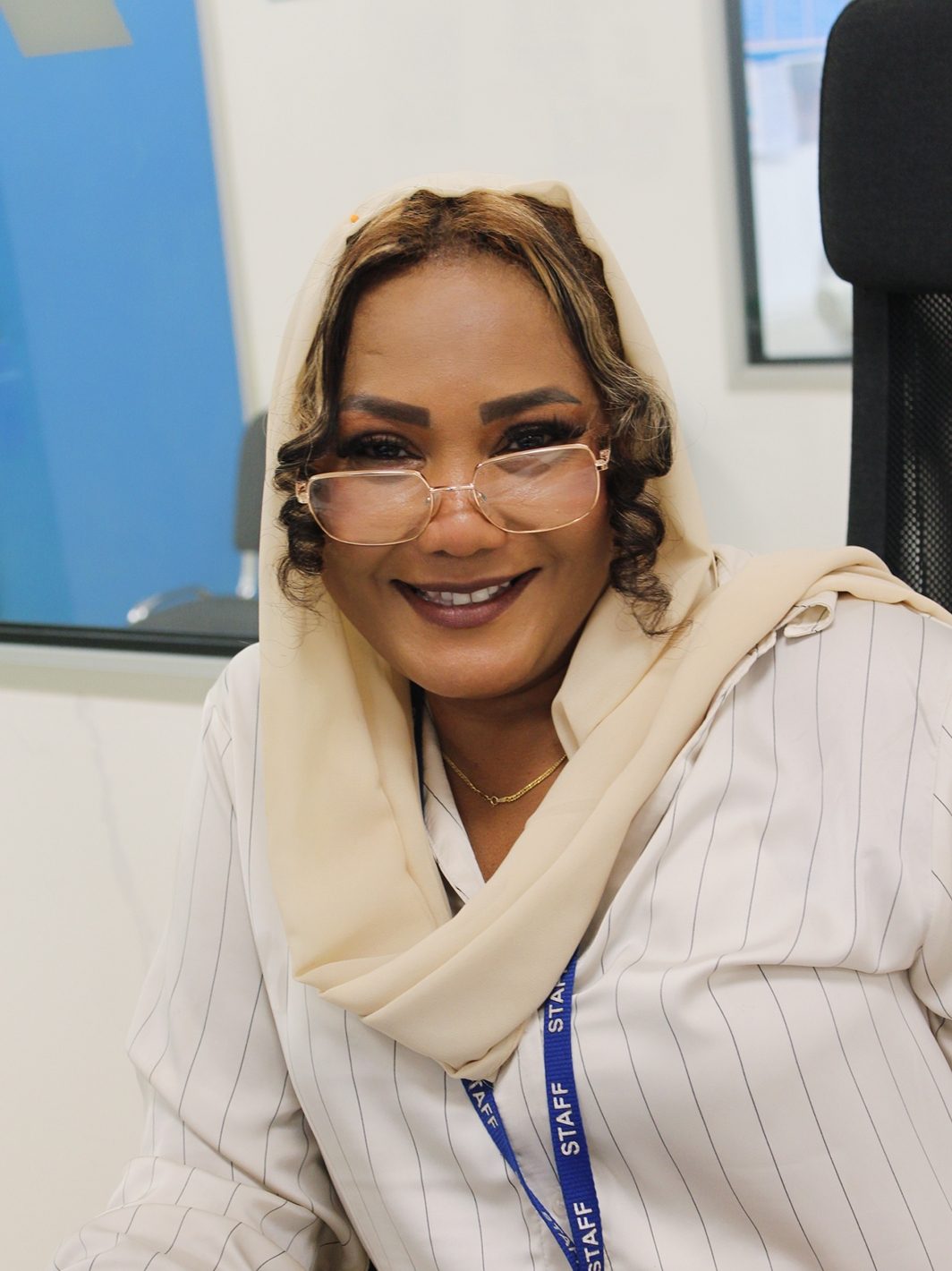 Smiling female caseworker at the Welsh Refugee Council.