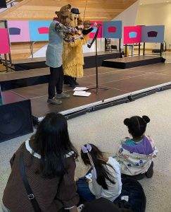 Musicians playing concert for sanctuary seeking families. 