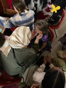 Face painting for a child at a Halloween party. 