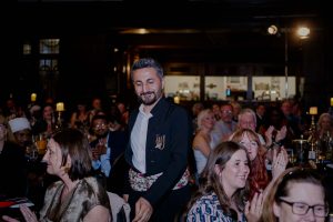 Nation of Sanctuary award winner on their way to the stage to collect an award.