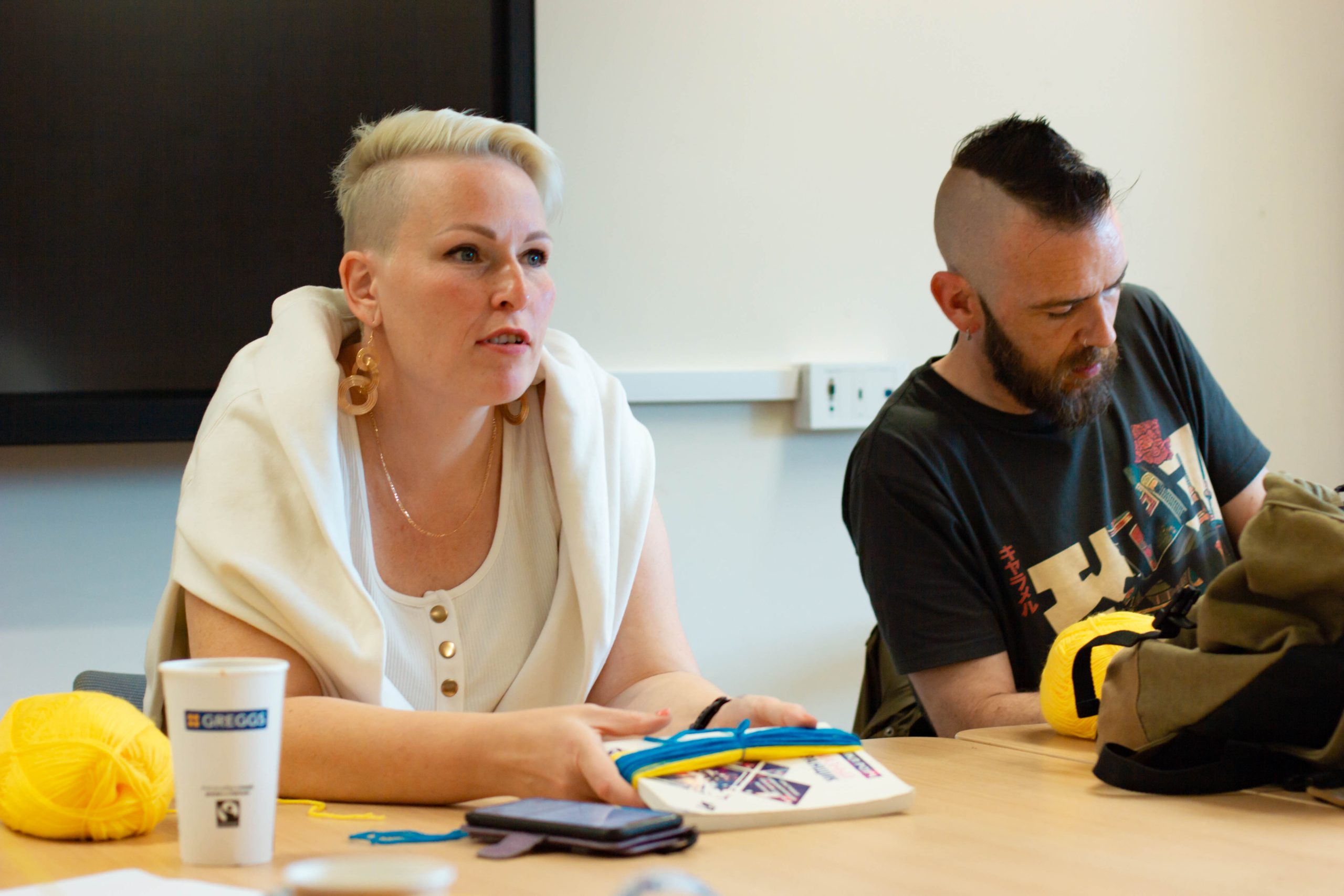 Woman leads a craft workshop with the Welsh Refugee Council.
