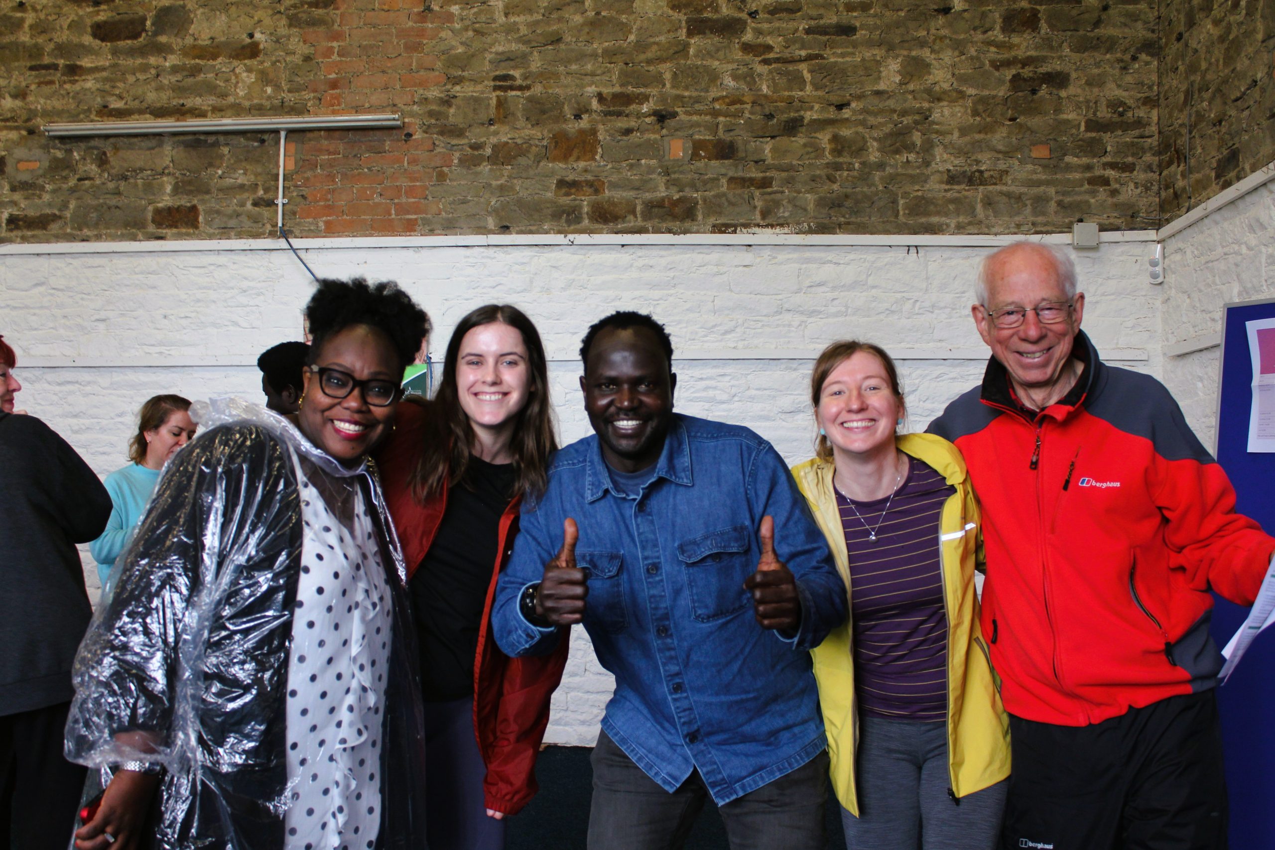 Welsh Refugee Council team smiling together at an event.