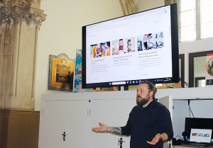Man presenting at an Education and Employability day with Welsh Refugee Council.