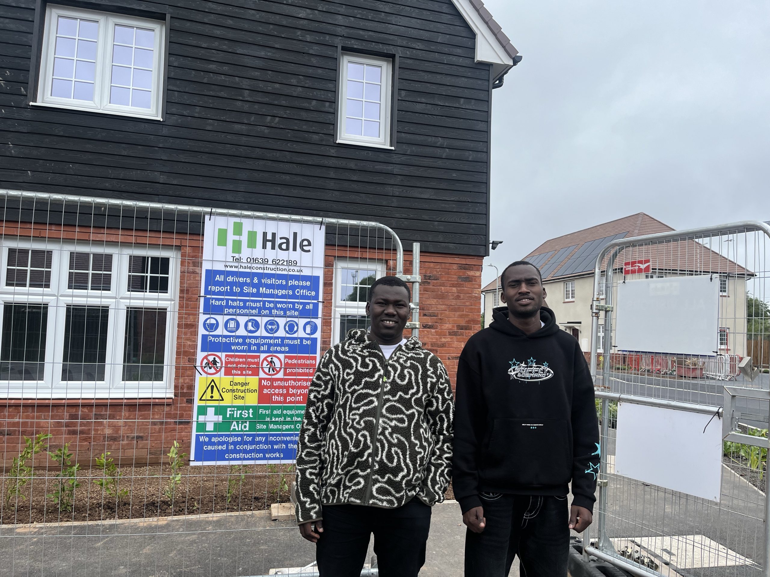 Two smiling men at a Welsh Refugee Council employability session.