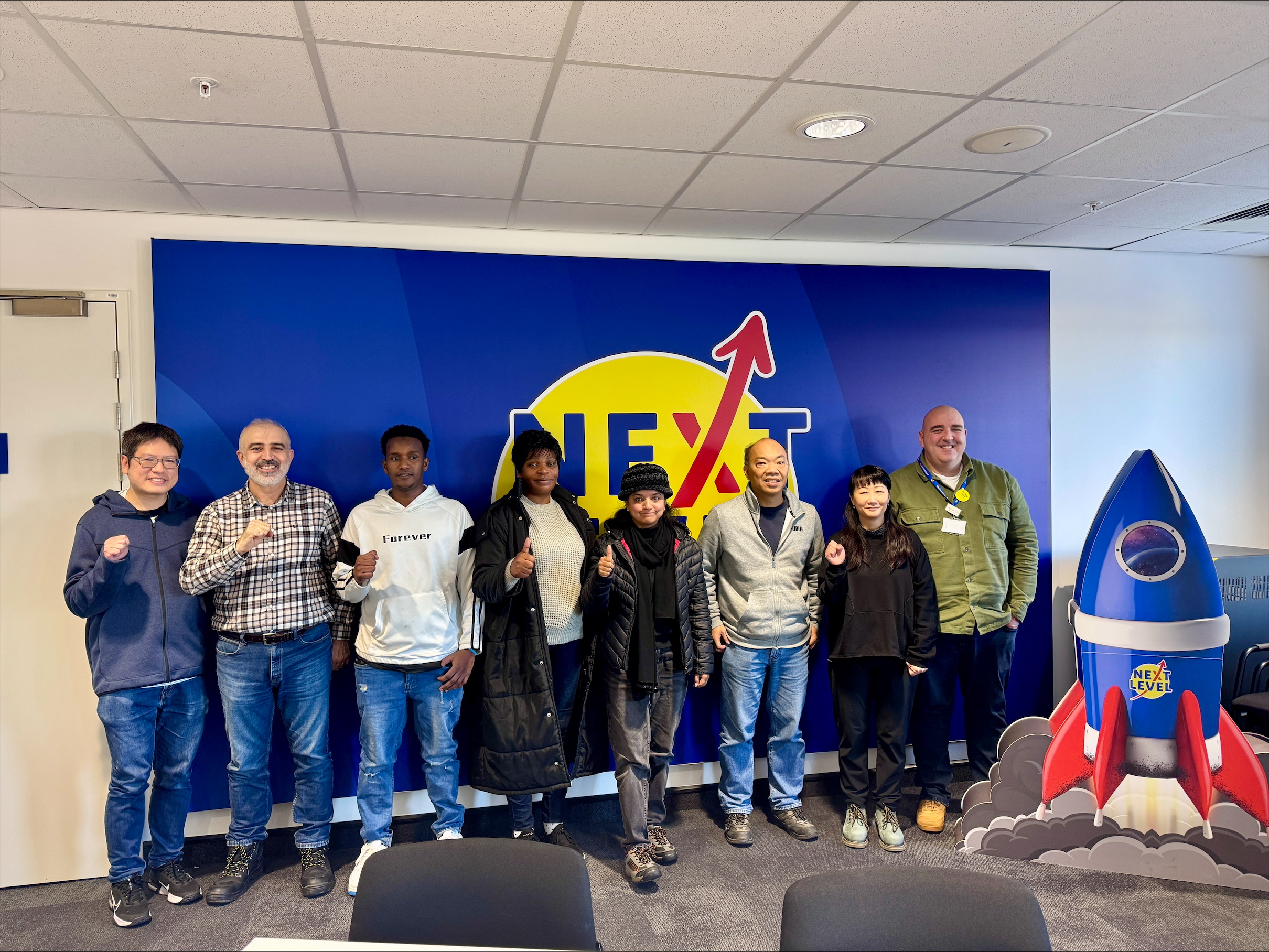 Smiling group of people at an Employability day with Welsh Refugee Council.